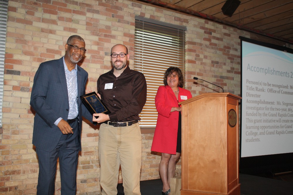 Mr. Joshua Church receives award from Dean Grant